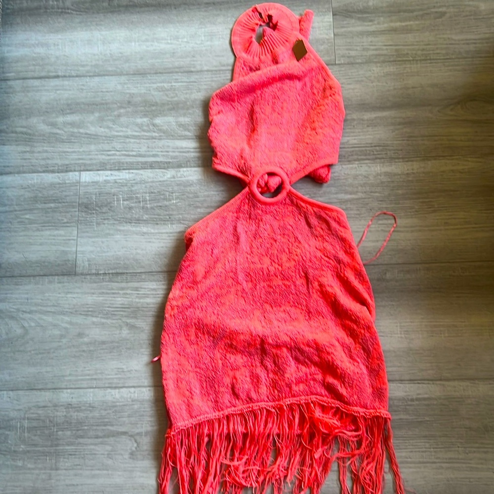 Backless orange halter dress with fringe